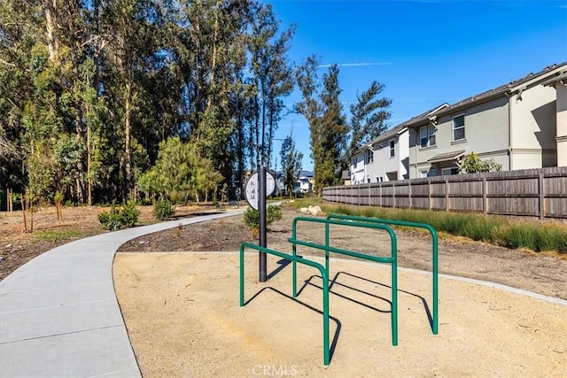 view of community featuring a residential view and fence