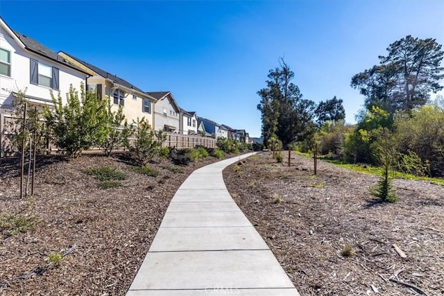 surrounding community featuring a residential view and fence