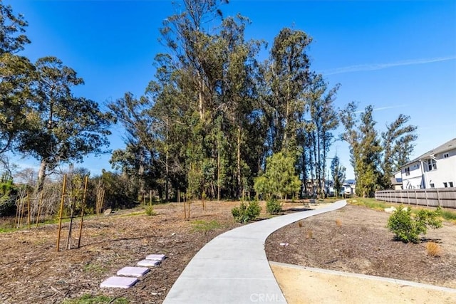 view of community featuring fence