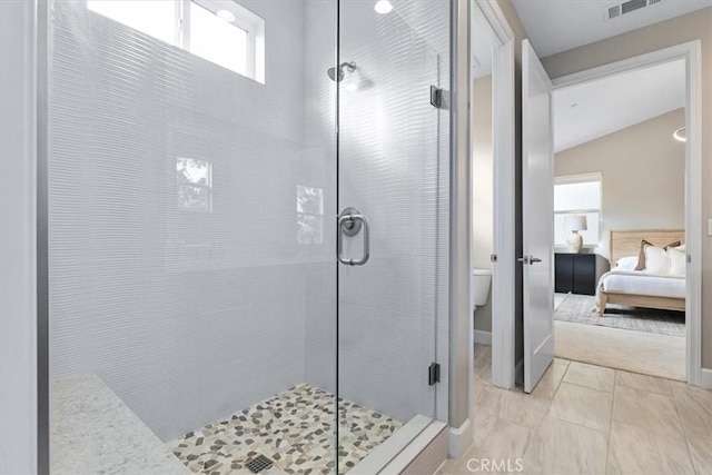 ensuite bathroom with a stall shower, ensuite bath, and toilet