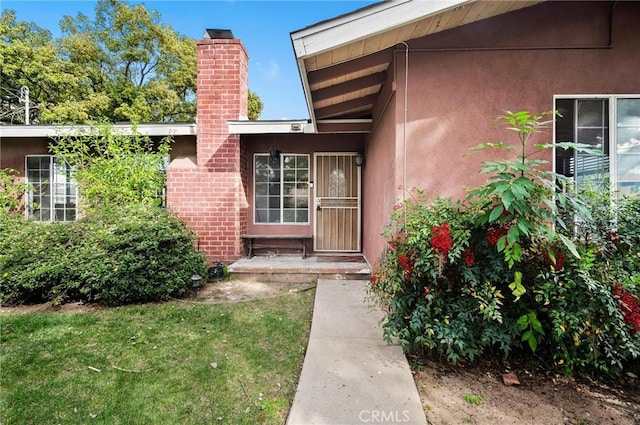 property entrance featuring a chimney