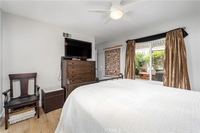 bedroom featuring access to outside, visible vents, ceiling fan, and light wood-style flooring