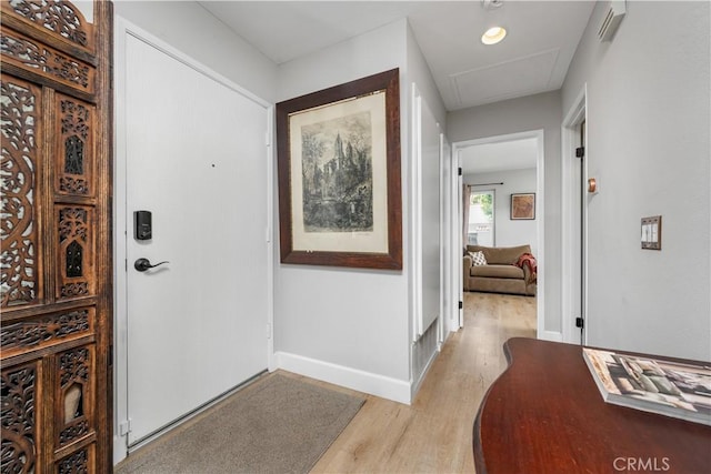 entrance foyer featuring baseboards and light wood finished floors