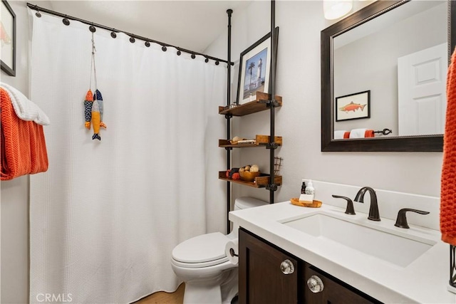 full bath featuring toilet, curtained shower, and vanity