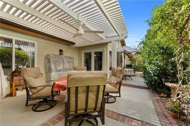 view of patio with french doors and a pergola