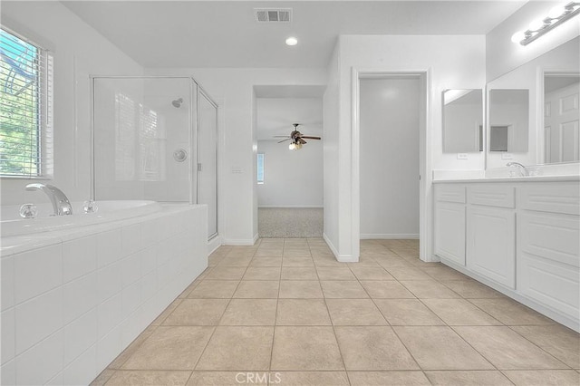 full bath featuring a stall shower, tile patterned flooring, a healthy amount of sunlight, and visible vents