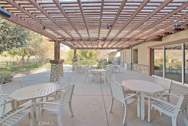 view of patio / terrace with outdoor dining area and fence