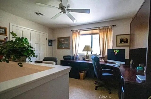 office area featuring a ceiling fan and visible vents