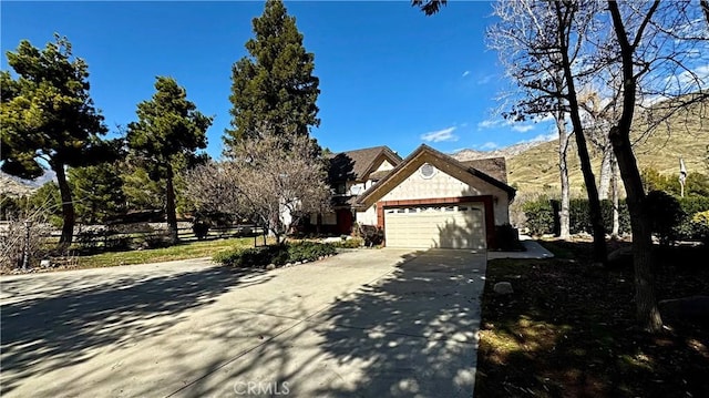 view of front of property featuring driveway and an attached garage