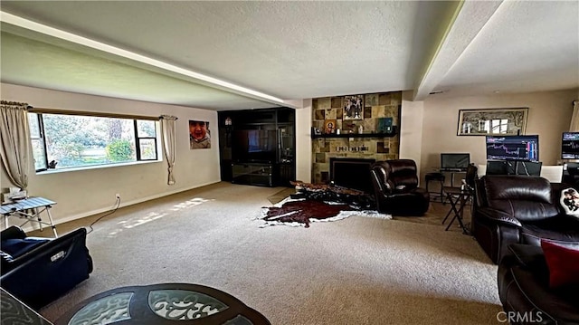 carpeted living room featuring beam ceiling, baseboards, a textured ceiling, and a stone fireplace