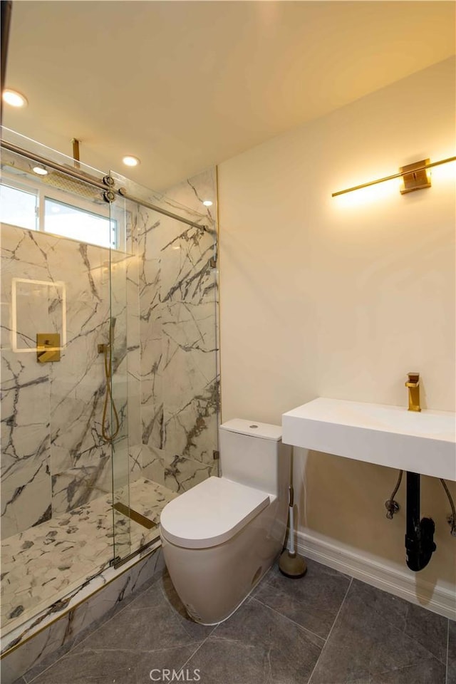 bathroom with a marble finish shower, toilet, and recessed lighting