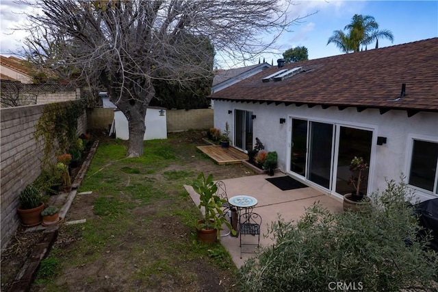 view of yard with a patio area and a fenced backyard