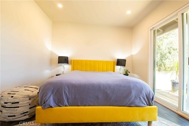 bedroom featuring recessed lighting, wood finished floors, and access to exterior