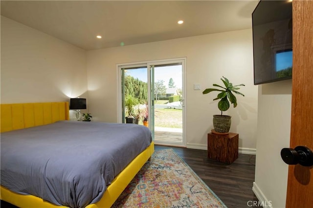 bedroom with access to outside, recessed lighting, wood finished floors, and baseboards