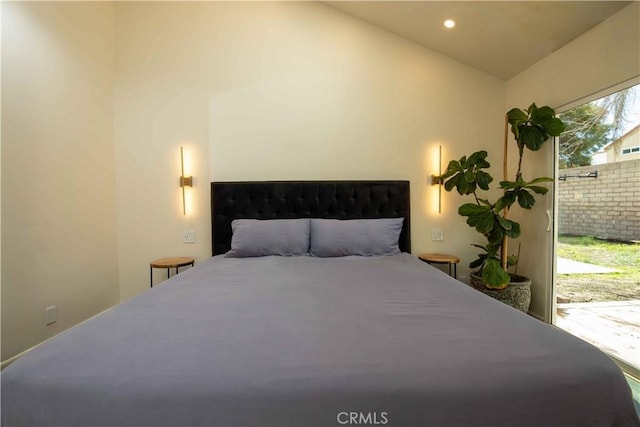 bedroom with lofted ceiling and recessed lighting