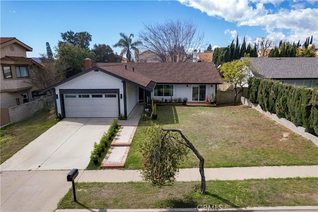 ranch-style home featuring an attached garage, fence, concrete driveway, stucco siding, and a front yard