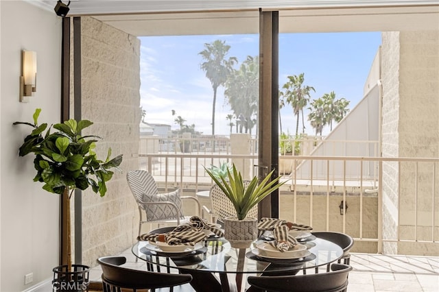 dining space featuring stone tile floors