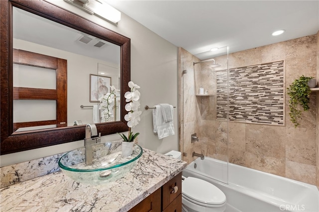 bathroom with toilet, shower / bathing tub combination, vanity, and visible vents