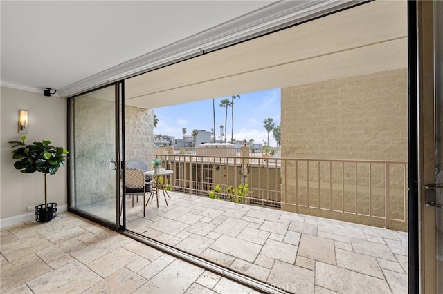 view of patio / terrace featuring a view of city and a balcony