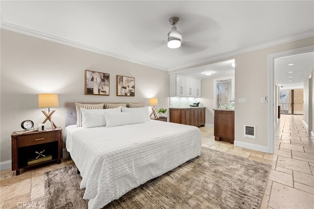 bedroom featuring stone tile flooring, visible vents, crown molding, and baseboards