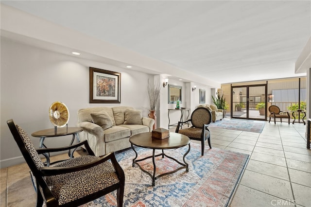 living area featuring expansive windows, light tile patterned flooring, baseboards, and recessed lighting