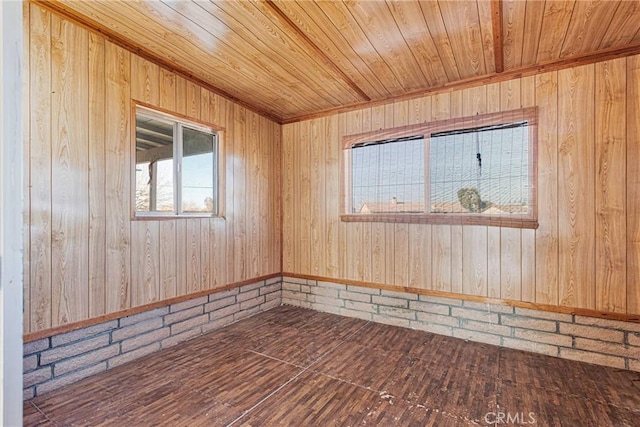 unfurnished room with wooden ceiling and hardwood / wood-style flooring