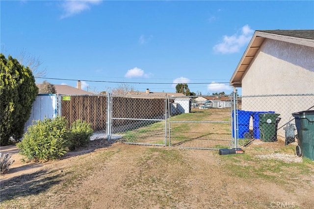 view of yard featuring a gate and fence