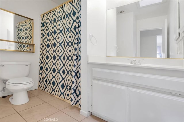 bathroom featuring curtained shower, visible vents, toilet, vanity, and tile patterned floors