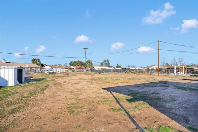 view of yard with a shed and an outdoor structure