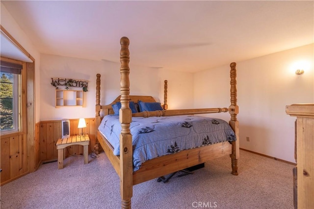 bedroom with carpet floors and baseboards