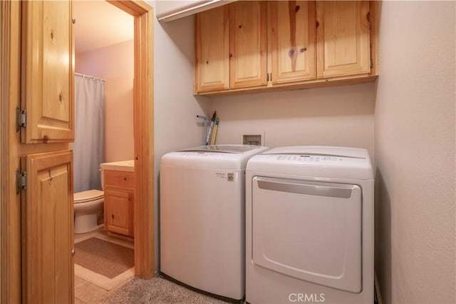 laundry room featuring cabinet space and washer and dryer