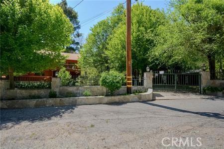 view of yard with a fenced front yard and a gate