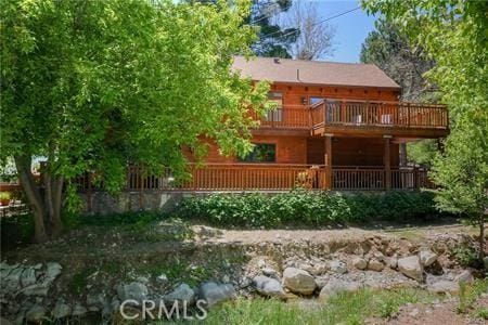 rear view of property with a deck