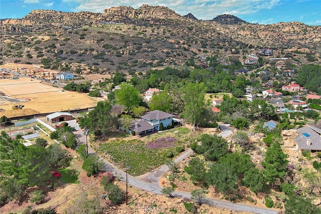 birds eye view of property with a mountain view