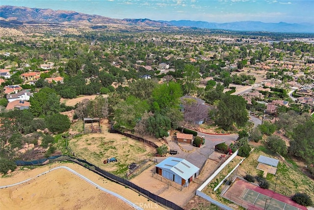 birds eye view of property featuring a mountain view