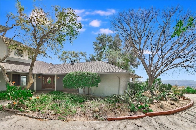 view of front of home featuring stucco siding