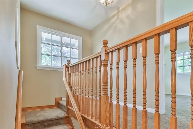 stairs with carpet flooring and baseboards