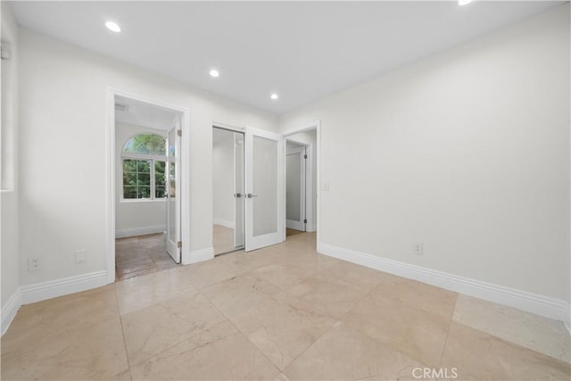 unfurnished bedroom featuring a closet, recessed lighting, and baseboards