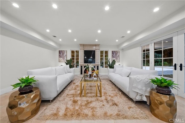 living area featuring recessed lighting and visible vents