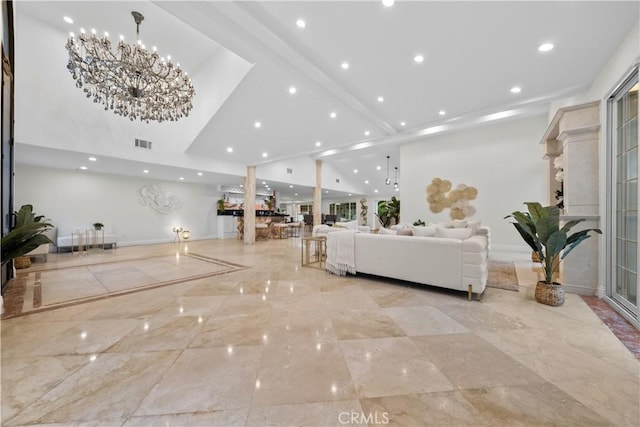 living room featuring a chandelier, recessed lighting, visible vents, baseboards, and marble finish floor