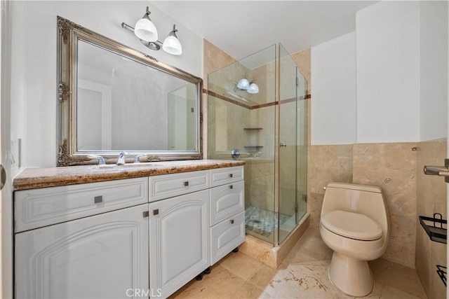 full bathroom with toilet, a stall shower, tile walls, and vanity