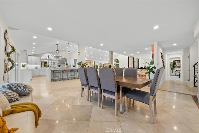 dining space featuring recessed lighting and lofted ceiling