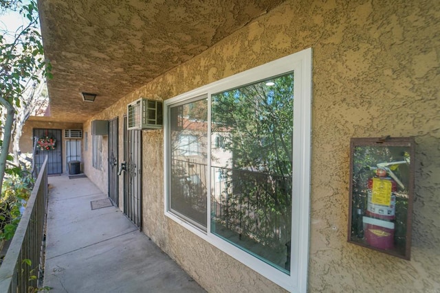 exterior space featuring an AC wall unit