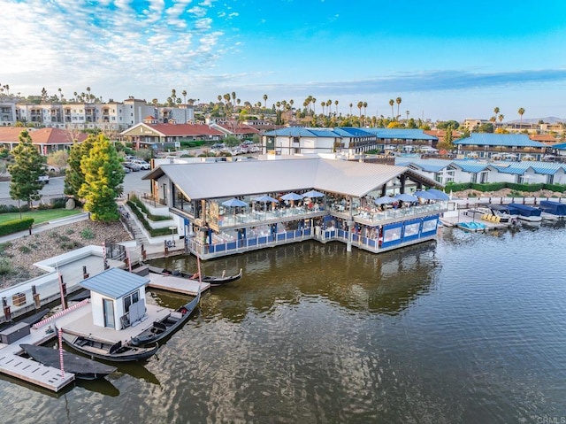 bird's eye view with a water view and a residential view