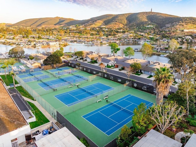 birds eye view of property featuring a residential view and a water and mountain view