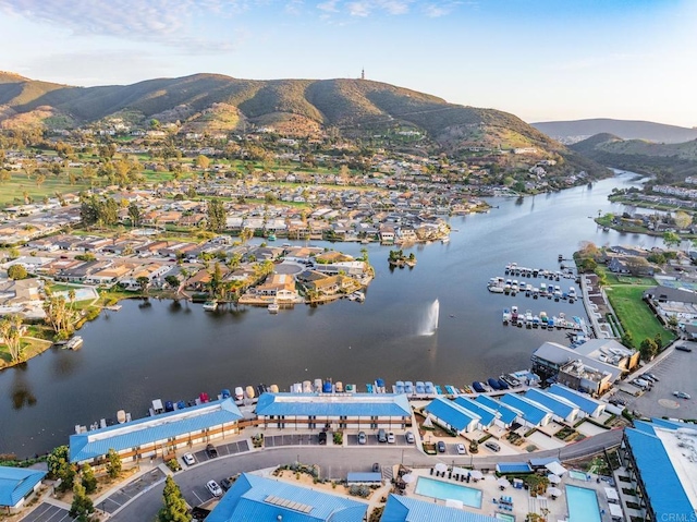 birds eye view of property featuring a water and mountain view