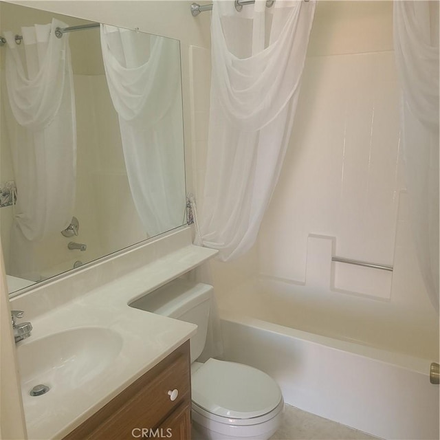 bathroom featuring toilet, shower / tub combo, and vanity