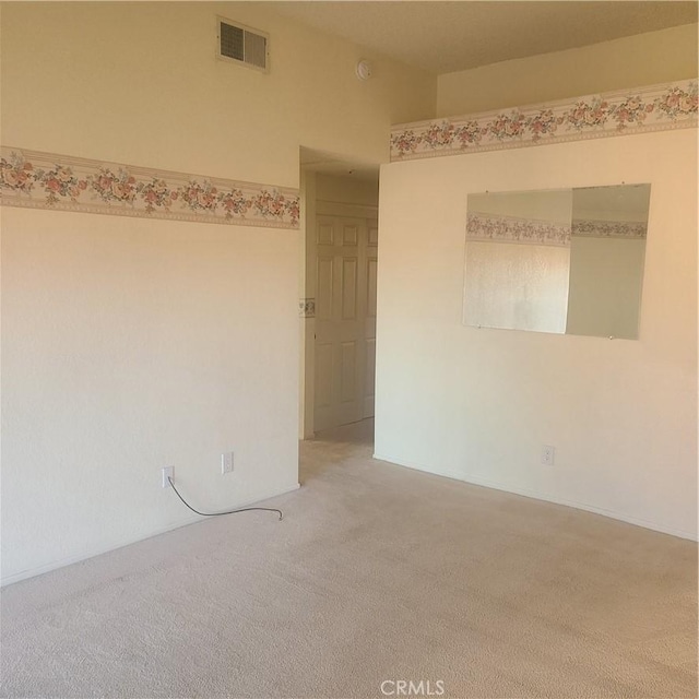 unfurnished room with light carpet and visible vents