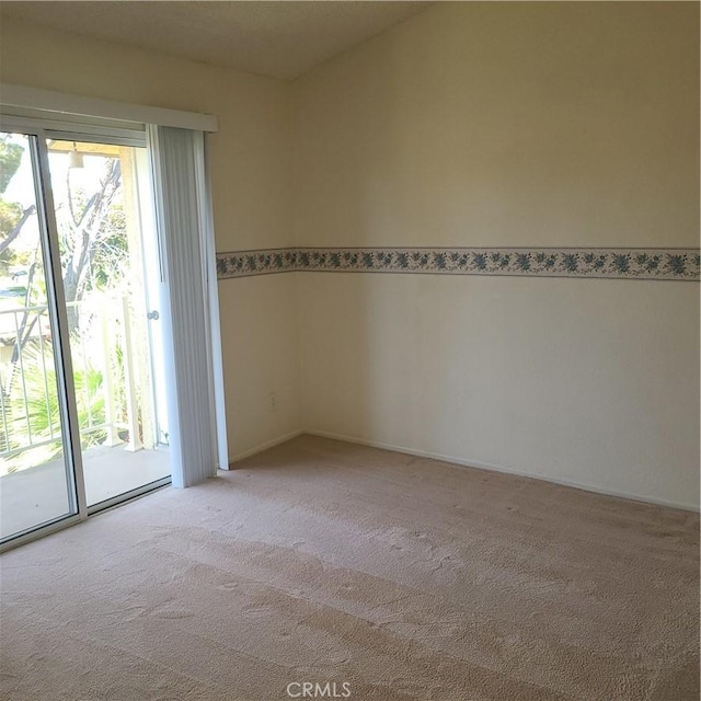 carpeted empty room with plenty of natural light