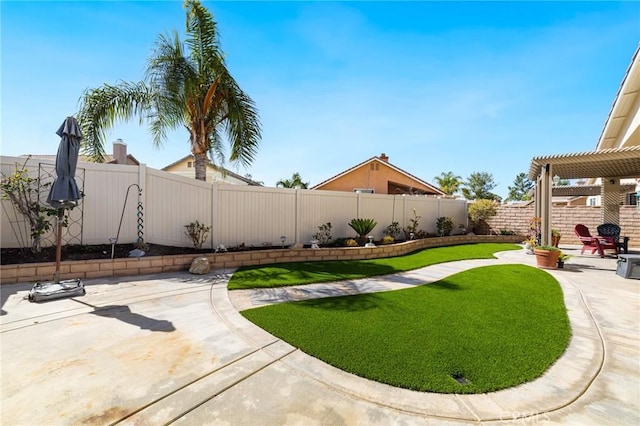 view of yard featuring a patio area, a fenced backyard, and a pergola